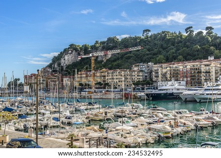 NICE, FRANCE - JULY 11, 2014: View on Port of Nice and yachts, boats, ships. French Riviera - turquoise sea and perfect recreation.