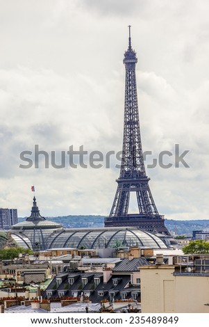 Panorama of Paris - Eiffel tower in the background. Tour Eiffel (Eiffel Tower) located on Champ de Mars in Paris, named after engineer Gustave Eiffel. View from Printemps store. France.
