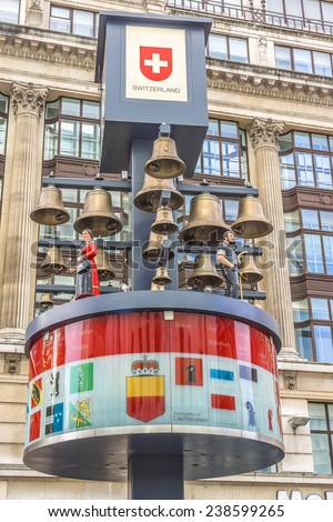 LONDON, UK - MAY 31, 2013: View of Swiss glockenspiel clock (erected 1985) on Leicester Square in London. Under the clock have 27 bells and figures of traditional Swiss Alpine farmers.