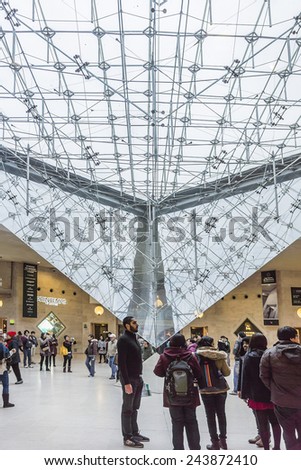 PARIS, FRANCE - DECEMBER 22, 2014: Inside the Louvres pyramid. Louvre Museum is one of the largest and most visited museums worldwide.
