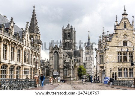 GHENT, BELGIUM - MAY 12, 2014: Tourists in city center of Ghent. Ghent is a city and a municipality located in the Flemish region of Belgium, capital and largest city of the East Flanders province.