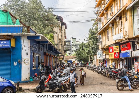 PANJIM, GOA, INDIA - SEPTEMBER 30, 2013: Street views of the capital of the Goa state: old houses and traffic. Panjim (Panaji) - capital of Indian state of Goa and Goa\'s largest city.