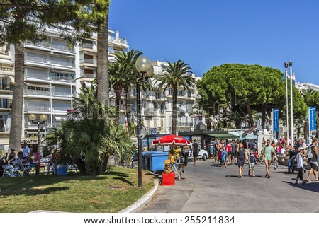 CANNES, FRANCE - AUGUST 30, 2011: Cityscapes Cannes. Cannes - a resort in southern France: many flowers and palm, luxury boutiques and restaurants, cafes, luxurious hotels - all for leisure travelers.