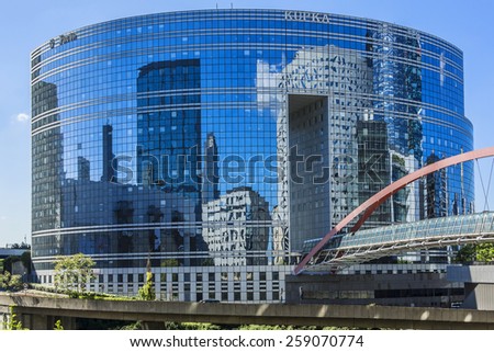 PARIS, FRANCE - MAY 15, 2014: Skyscrapers in business district of Defense to the west of Paris. Defense is biggest business district in France and most of large companies have offices here.