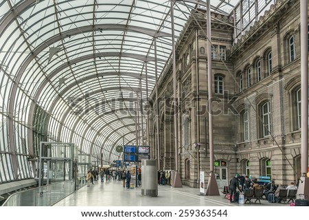 STRASBOURG, FRANCE - DECEMBER 21, 2014: Gare de Strasbourg, the main railway station of Strasbourg city, Alsace region, France. View of original building under the modern glass canopy.