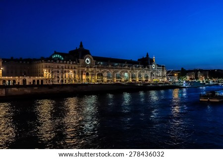 D\'Orsay Museum on left bank of Seine at night. Museum is housed in former Gare d\'Orsay. Orsay holds mainly French art dating from 1848 to 1915. Paris, France.