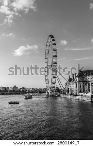 LONDON - JUNE 2, 2013: View of the London Eye. London Eye (135 m tall, diameter of 120 m) - a famous tourist attraction over river Thames in the capital city London. Black and white.