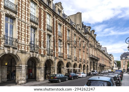 Place des Vosges - oldest planned square in Paris, in Marais district. Place des Vosges was built by Henri IV from 1605 to 1612.