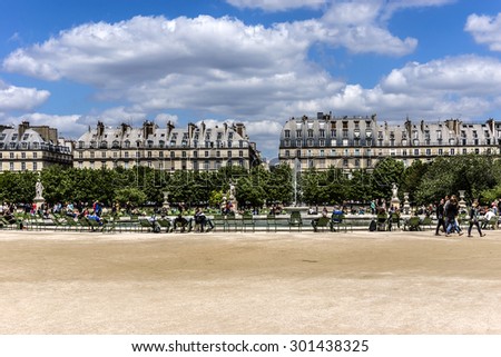 PARIS, FRANCE - JUNE 1, 2015: Local and Tourist in famous Tuileries garden. Tuileries Garden (Jardin des Tuileries) is a public garden located between the Louvre Museum and the Place de la Concorde.