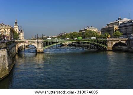 The picturesque embankments of the Seine River and bridge. Paris, France.
