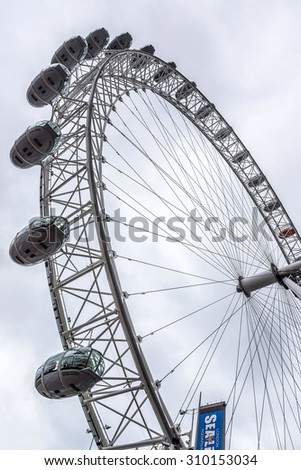 LONDON, UK - MAY 30, 2012: View of the London Eye. London Eye (135 m tall, diameter of 120 m) - a famous tourist attraction over river Thames in the capital city London.