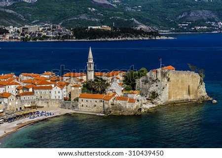 Landscape of Old town Budva: Ancient walls and red tiled roof. Montenegro, Europe. Budva - one of the best preserved medieval cities in the Mediterranean and most popular resorts of Adriatic Riviera.