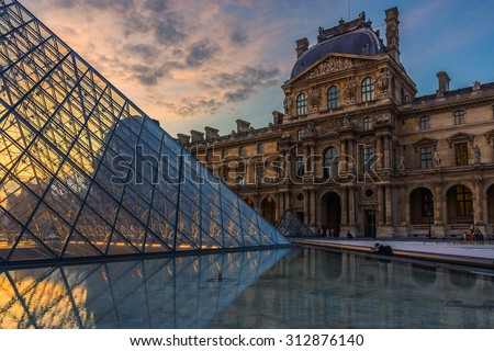 PARIS, FRANCE - JUNE 10, 2015: View of famous Louvre Museum on the Sunset. Louvre Museum is one of the largest and most visited museums worldwide.