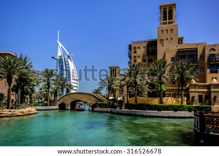 DUBAI, UNITED ARAB EMIRATES - SEPTEMBER 10, 2015: View of Burj Al Arab hotel from Madinat Jumeirah hotel. Madinat is a luxury resort which includes hotels and souk covering an area over 40 hectars.