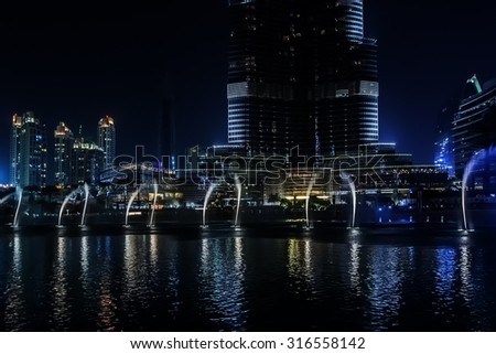 DUBAI, UNITED ARAB EMIRATES - SEPTEMBER 8, 2015: A record-setting fountain system set on Burj Khalifa Lake - 6600 lights and 25 projectors, it shoots water 150 m into the air. UAE.