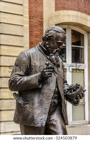 PARIS, FRANCE - JUNE 6, 2015: Museum of Arts and Crafts (1794) houses collection of National Conservatory of Arts and Industry - museum of technological innovation. Zenobe Gramme statue near entrance.