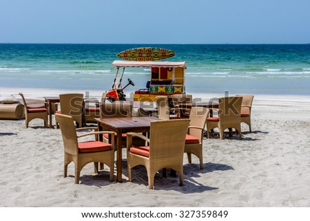 AJMAN, UNITED ARAB EMIRATES - SEPTEMBER 5, 2015: Beautiful beach Ajman Kempinski Resort - luxurious 5-star hotel nestled near turquoise waters of Arabian Gulf. Resort has 166 sea view rooms, 14 suites
