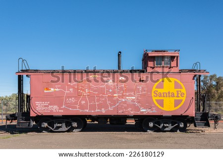 GALLUP, NEW MEXICO - SEPT 6, 2014: Map of New Mexico and Arizona painted on Santa Fe Train Caboose with stops and attractions along train route and historic old Route 66, the Mother Road.