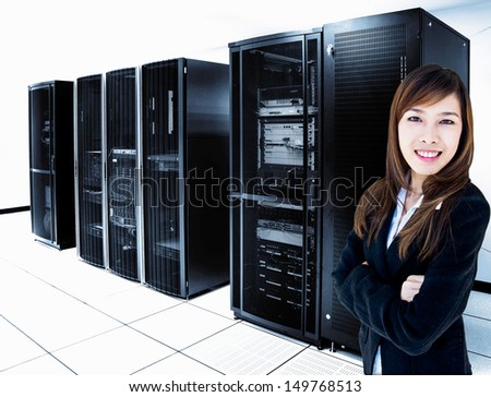 female administrator standing in server room