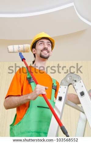 Painter worker during painting job