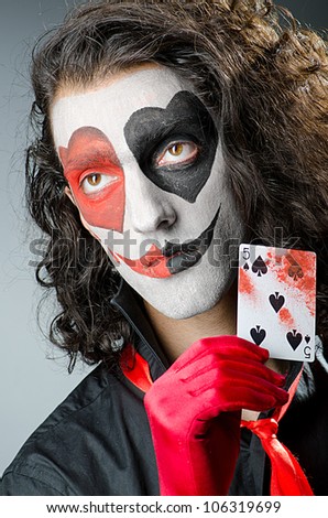 Joker with face mask in studio