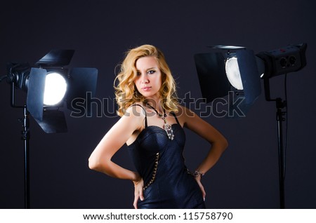 Young attractive woman in photo studio