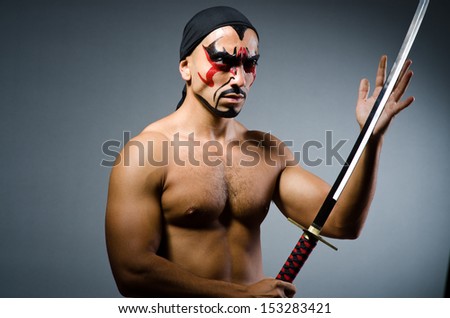 Man with sword and face paint