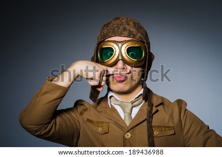 Funny pilot with goggles and helmet