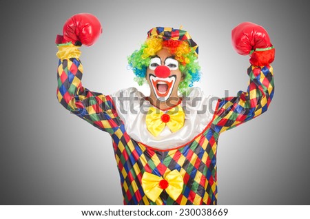 Clown with boxing gloves isolated on white