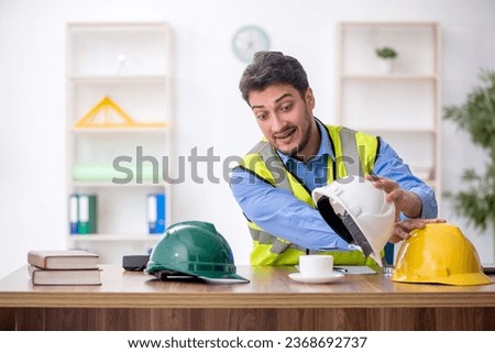 Similar – Image, Stock Photo Architect man having breakfast while working at computer in office