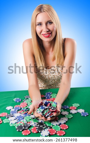 Woman in casino playing cards