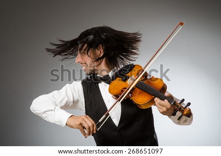 Musician plays cello isolated on white