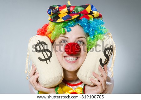 Clown with money bag in funny concept