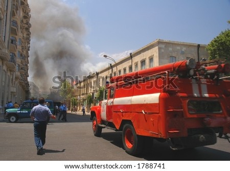 Fire truck rushing to fire in the city center