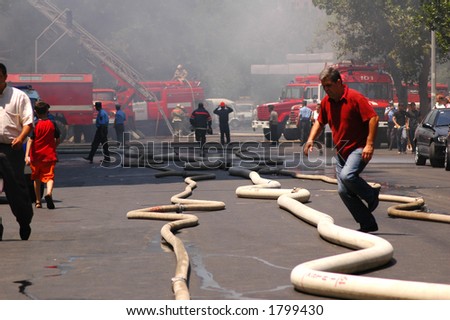 Fire hoses stretching across the street during fire