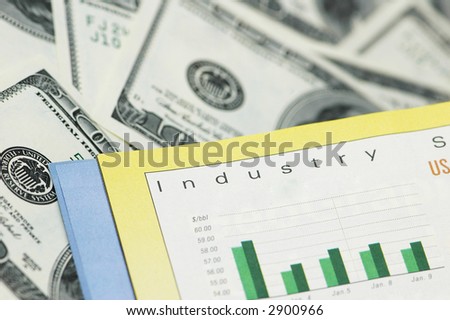Business concept - Bar charts and  dollar bank notes