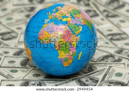 Globe isolated  on the background of dollar bank notes