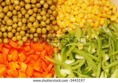 Close up of salad with corn, carrots, peppers and peas
