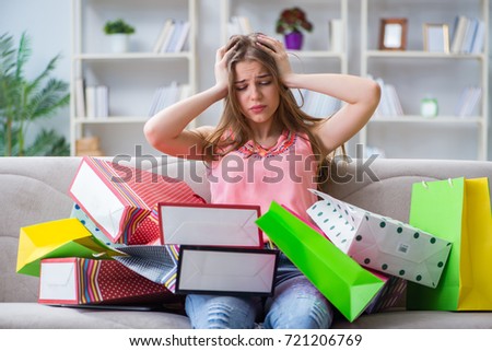 Young woman with shopping bags indoors home on sofa ストックフォト © 
