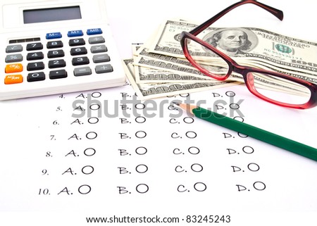 The test list ,pencil, glasses,  US Dollars and  Calculator  on the examination