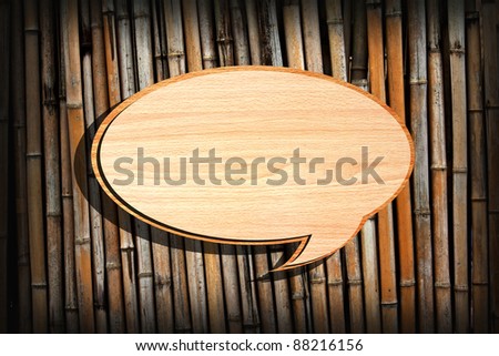 Retro speech bubbles from splat on bamboo wall background