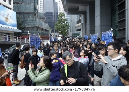 HONG KONG - March 2: Hongkongers putting blue ribbons, symbol of Press freedom, on the banners outside Hong Kong Police Headquarters to support press freedoms on March 2, 2014 in Hong Kong.