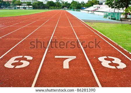 Number six  seven and eight on the start of a running track
