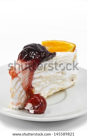 banana stuff cake with cherry raspberry mix orange on white