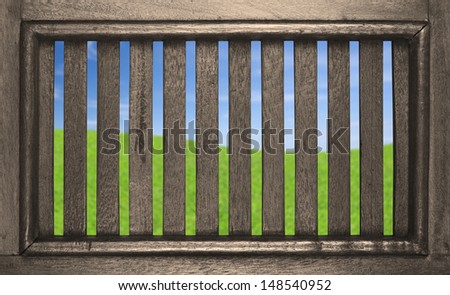 meadow of dream in the hole on golden teak window, included clipping path