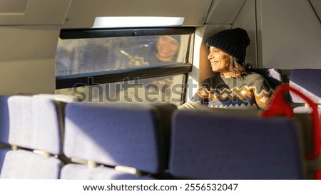 Similar – Image, Stock Photo Tourists gazing at breathtaking snowy mountain slope