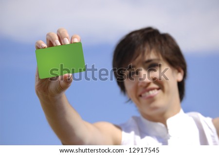 Young woman with a green credit card clean