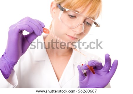 young female scientist, nurse works on blood samples in two small test tubes, also holds pipette with red liquid, studio shoot isolated on white