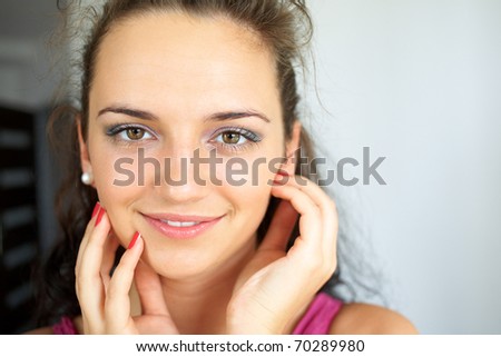 close up of beautiful woman face with makeup, wide open eyes