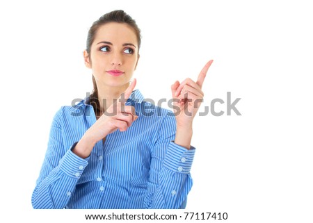 attractive brunette businesswoman points her fingers up and to the side, isolated on white